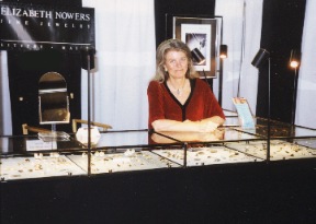 Elizabeth in her booth at a show